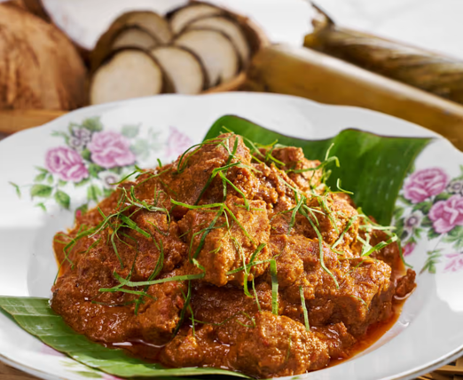 Malay Cuisine in SG : Close-up of fragrant rendang beef slow-cooked in spices and coconut milk, a signature of Malay cooking