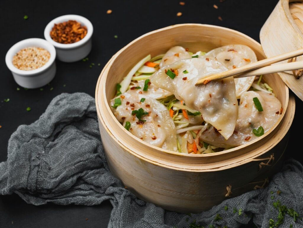 Chinese Cuisines SG : Cantonese dim sum selection with har gow, siu mai, and char siu bao at a modern Chinese restaurant