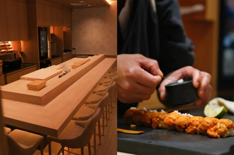 A minimalist Japanese omakase sushi bar with a clean wooden counter and a chef skillfully preparing uni (sea urchin) nigiri sushi.