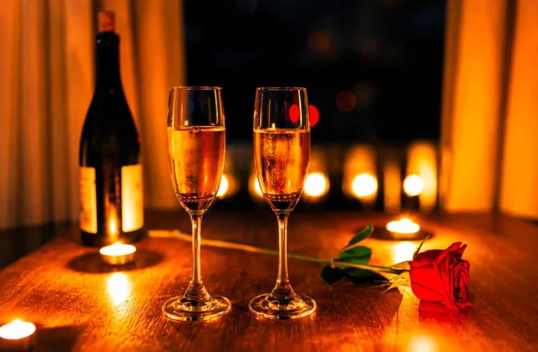 Elegant romantic rooftop dining Singapore scene at a rooftop bar with two champagne flutes, a red rose, and flickering candles on a table, perfect for a romantic date night or special occasion at rooftop restaurants overlooking Marina Bay, the Singapore skyline, and Marina Bay Sands. Capturing the ambience of romantic restaurants and the most romantic restaurants in the city, this fine dining restaurant in Singapore blends contemporary Asian cuisine and Italian restaurant influences, offering great food, signature cocktails, steaks, wine, and imaginative menu creations by an executive chef. Guests enjoy impeccable service, a la carte dishes, new menu highlights, and stunning views of the Singapore Flyer, city skyline, and city lights. Ideal for corporate events, lunch, dinner, or afternoon bites, the location at Collyer Quay offers breathtaking views at sea level with skyline views that soak in the world‑class backdrop. The rooftop space invites dining under the night sky, where friends and couples sip drinks, explore flavours, and feast on quality food paired with cocktails, wine, and steaks. The elegant yet casual atmosphere makes it a celebration to miss at your peril, with every bite a delight and every note of taste a blend of fun and romance. Perfect for sunset, evening, or date experiences, this destination offers access to the east and beyond, making it a must‑visit for restaurants lovers who want to literally explore the best dining, bar, and event spaces in Singapore.