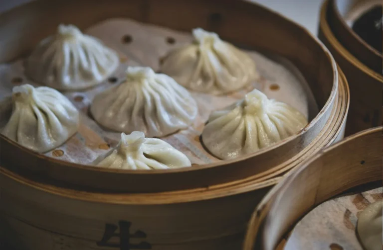 Chinese Cuisine : Steaming basket of xiao long bao showcasing delicate craftsmanship
