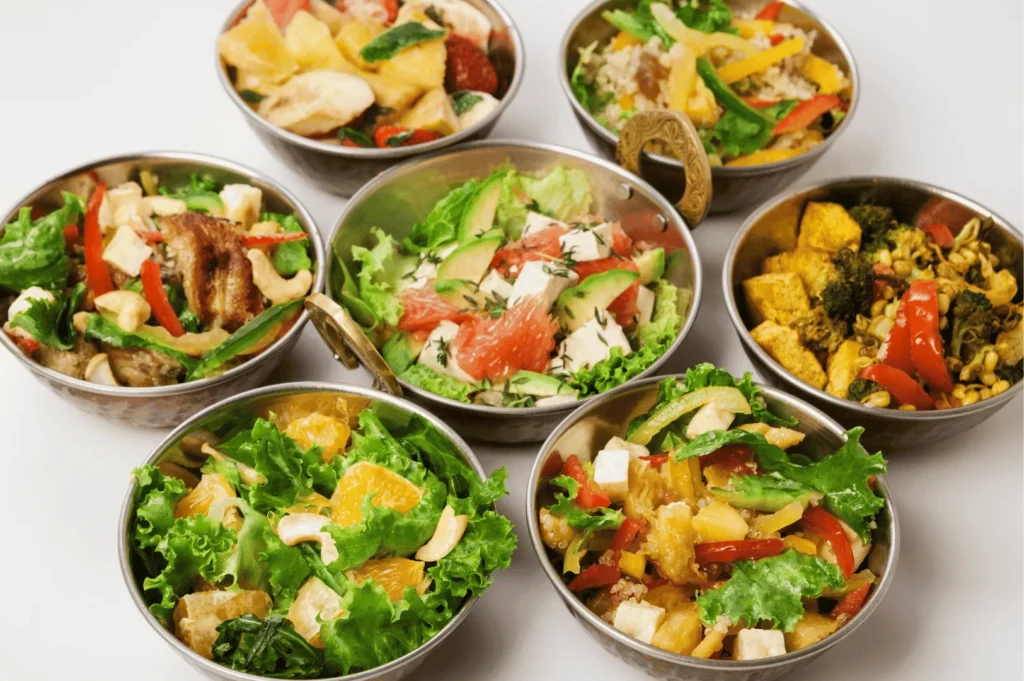 Seven vibrant bowls of fresh salads featuring colorful combinations of vegetables, fruits, tofu, grilled chicken, and nuts—highlighting the diversity of healthy dining options near Little India, Singapore, where global flavors meet local wellness trends.