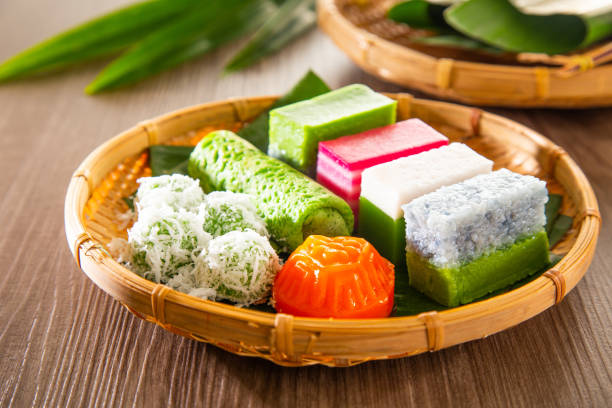Peranakan Cuisine in Singapore : Traditional Nyonya kueh with pandan, gula melaka, coconut, and rice flour showcases artisanal skill.