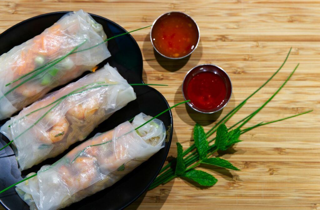 Vietnamese Cuisine in SG: Colorful spread of spring rolls, noodles, and dipping sauces