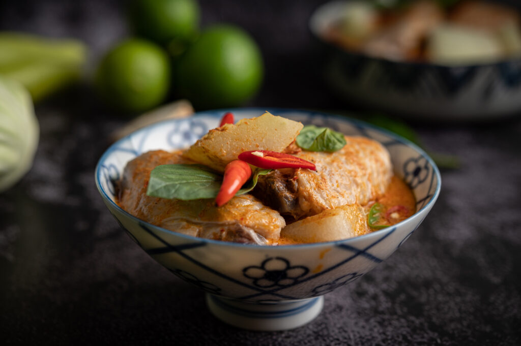 Peranakan Cuisine in Singapore : Authentic rempah preparation capturing the balance of sweet, savoury, tangy, and spicy flavors.