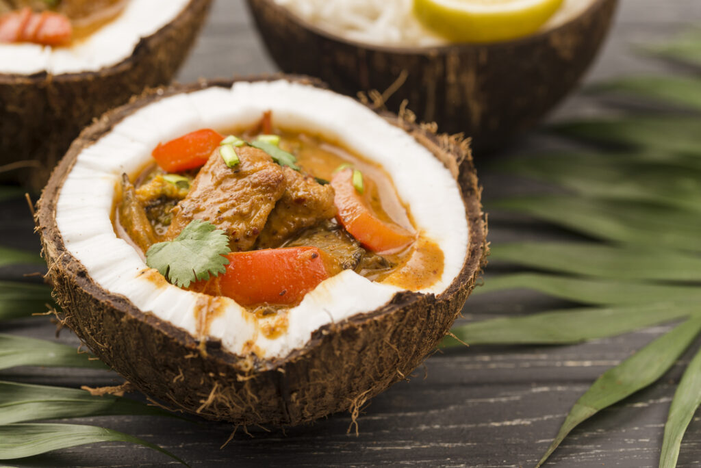 Thai Cuisine in Singapore : Coconut milk adding creamy richness to curries and soups
