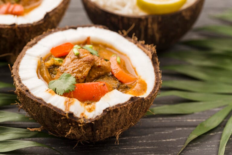 Thai Cuisine in Singapore : Coconut milk adding creamy richness to curries and soups