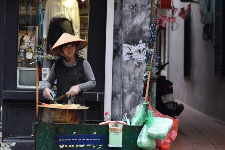 Vietnamese Cuisine in SG : Bustling street food stall serving traditional Vietnamese snacks