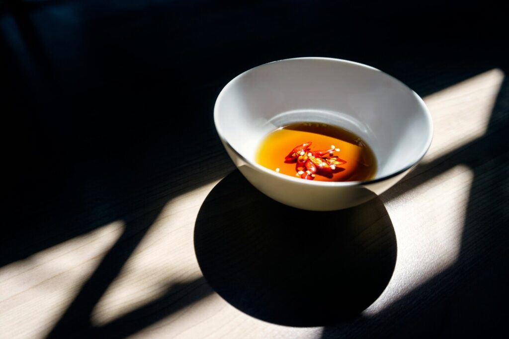 Vietnamese Cuisine in SG : Amber-colored fish sauce poured into a bowl