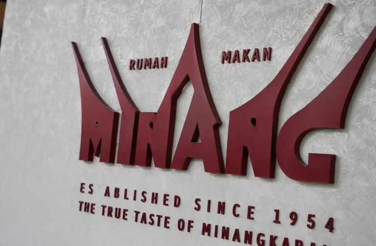 Minang Rumah Makan sign displaying "Established Since 1954" and Minangkabau branding