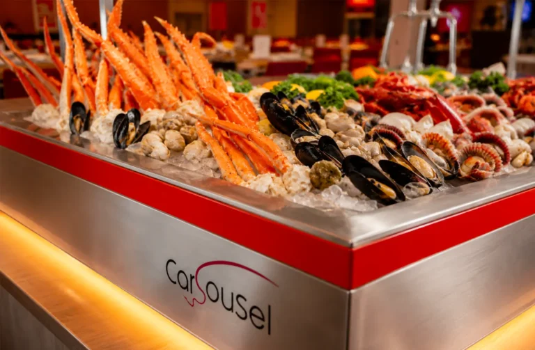 Seafood buffet display featuring crab legs and mussels at Carousel restaurant
