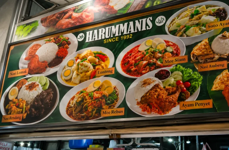 Harummanis restaurant menu board displaying dishes like Nasi Lemak, Mee Siam, and Nasi Rendang