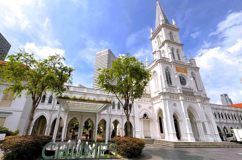 CHIJMES in Singapore, showcasing its historic architecture and vibrant atmosphere, surrounded by lush greenery.