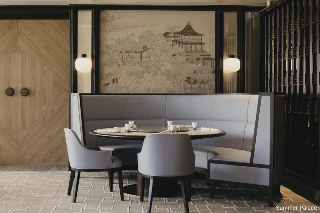 Interior of Summer Palace restaurant featuring a round table and chairs, designed for private fine dining experiences.