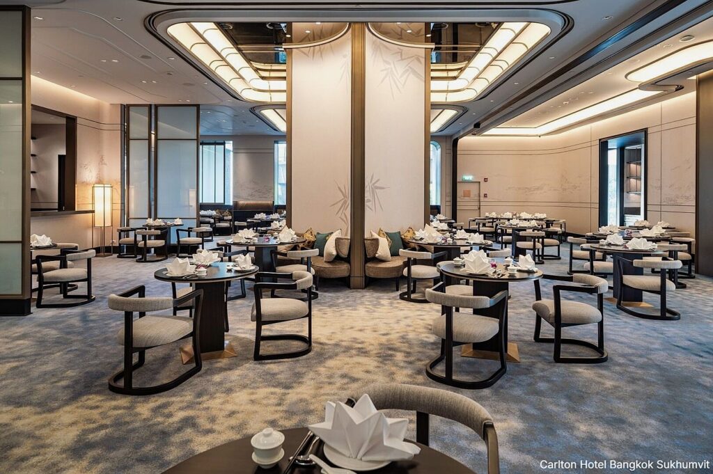 The dining room of Wah Lok Cantonese Restaurant, showcasing an elegant atmosphere with stylish furnishings and decor.