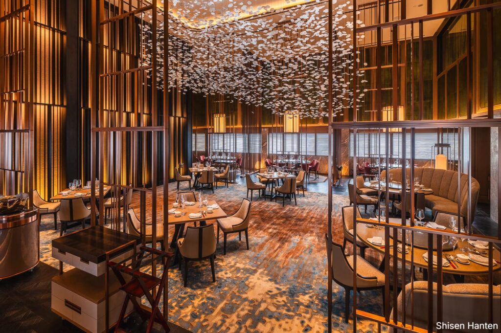 Interior of Shisen Hanten at the Ritz-Carlton, Hong Kong, showcasing a luxurious dining space with refined decor.