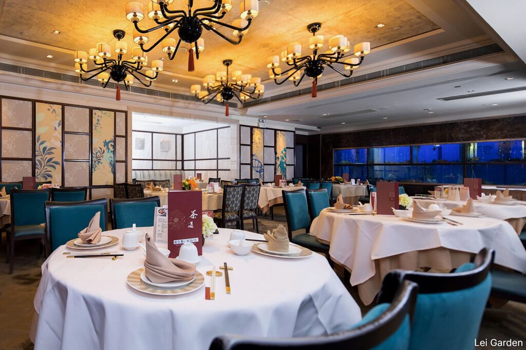 Interior of Lei Garden restaurant, showcasing tables and chairs arranged for an inviting dinner atmosphere.