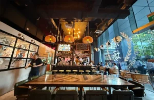 Dining area of Singapore Izakaya with neatly set tables and chairs for guests.