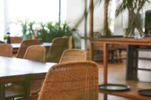 A table surrounded by chairs, located in Singapore's most exceptional restaurant.