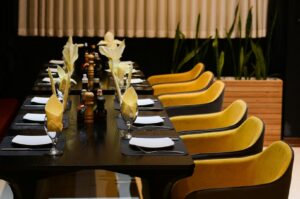 Elegant table with a black tablecloth, showcasing premier dining in Singapore.