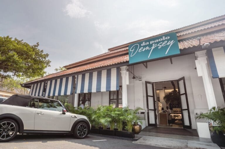 Outside view of a Dempsey Hill restaurant in Singapore, showcasing the vibrant dining atmosphere.