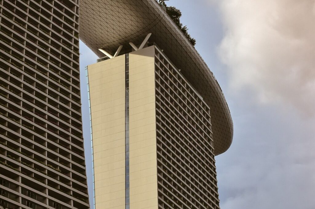 Marina Bay Sands, a tall building with a famous roof, stands prominently in Singapore's lively restaurant scene.