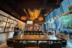 Dining area of Singapore Izakaya with neatly set tables and chairs for guests.