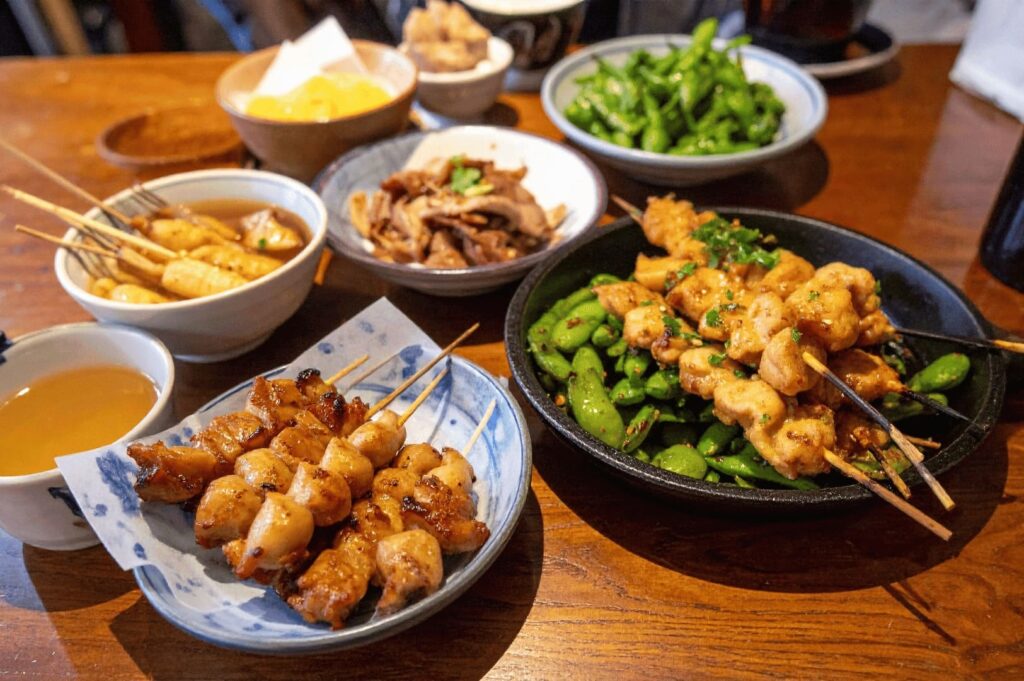 An assortment of food items displayed on a table, representing the culinary offerings of Singapore Izakaya.