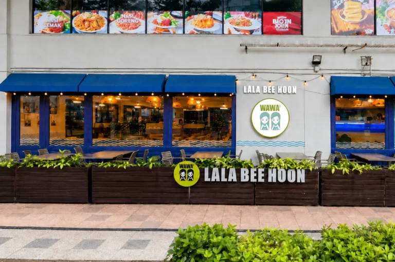 Wawa Lala Bee Hoon restaurant exterior featuring blue awnings, wooden planters, and food menu displays