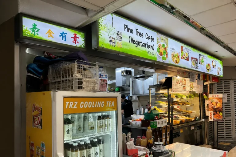 Pine Tree Cafe vegetarian hawker stall with food display and cooling tea fridge