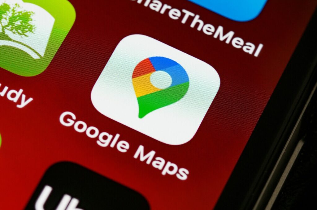 Smartphone featuring the Google Maps app interface, highlighting a map and location details.