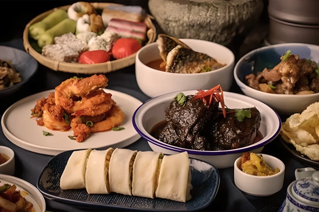 A vibrant display of Asian dishes, including braised meat with herbs, crispy shrimp, rice rolls, and colorful desserts, conveying a festive ambiance.