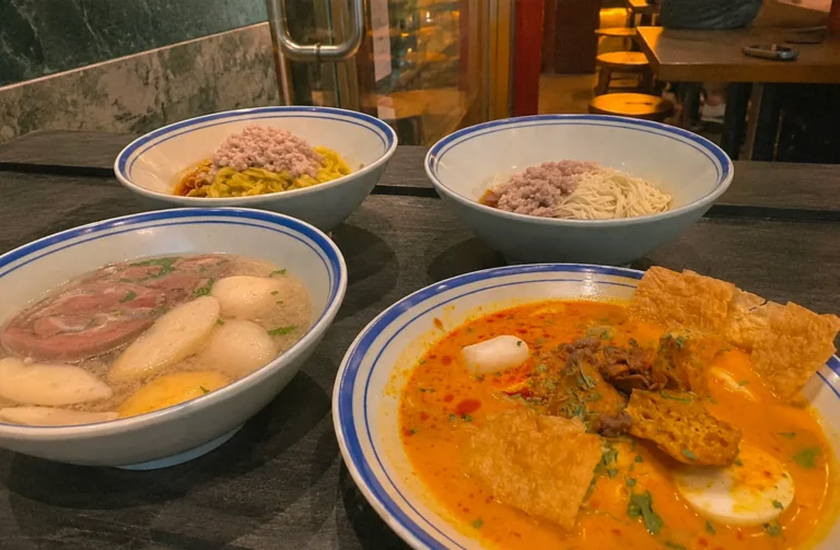 Assorted Orchard dishes including dry noodles, fish ball soup, and curry laksa.
