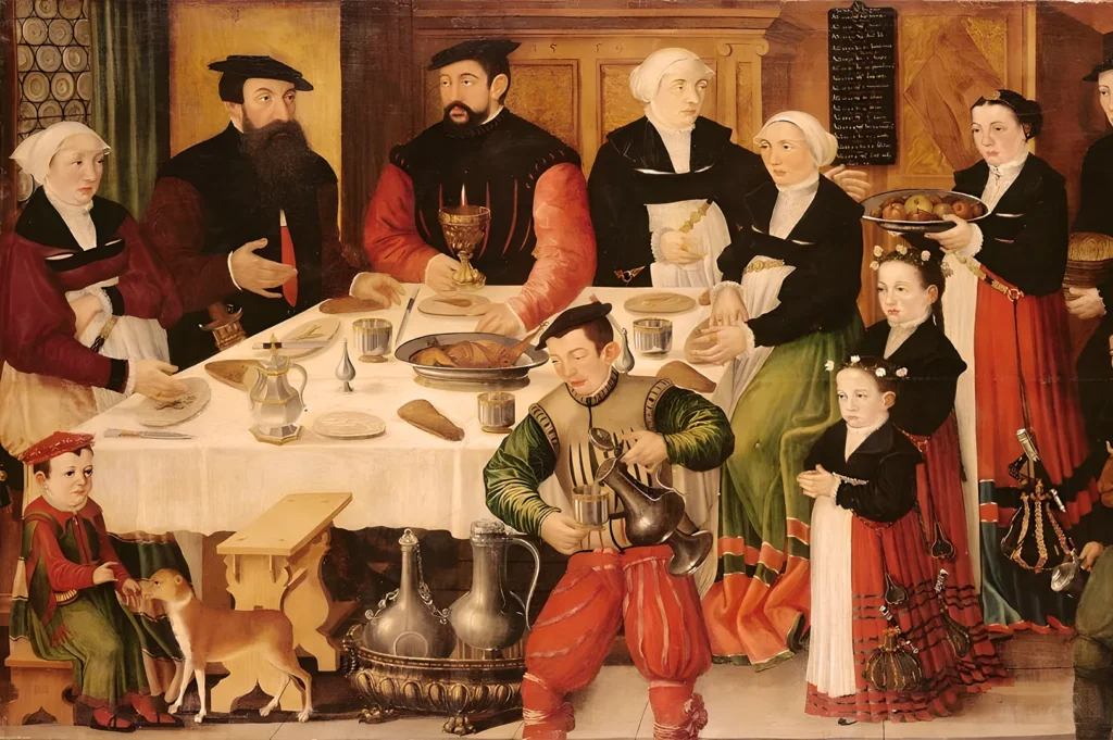 A Renaissance-era banquet featuring elegantly dressed figures around a table laden with food. The mood is convivial, with a person pouring wine and a dog nearby.