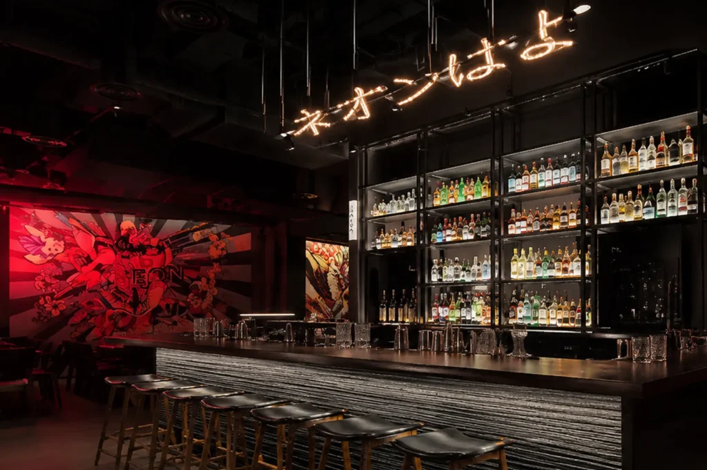 Stylish cocktail bar and backlit liquor display at Neon Pigeon Singapore