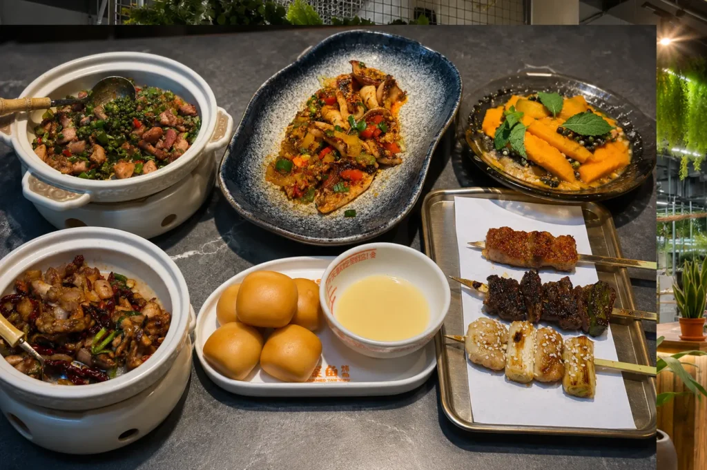 Delicious spread of Chinese food including claypot dishes, skewers, steamed buns, and pumpkin