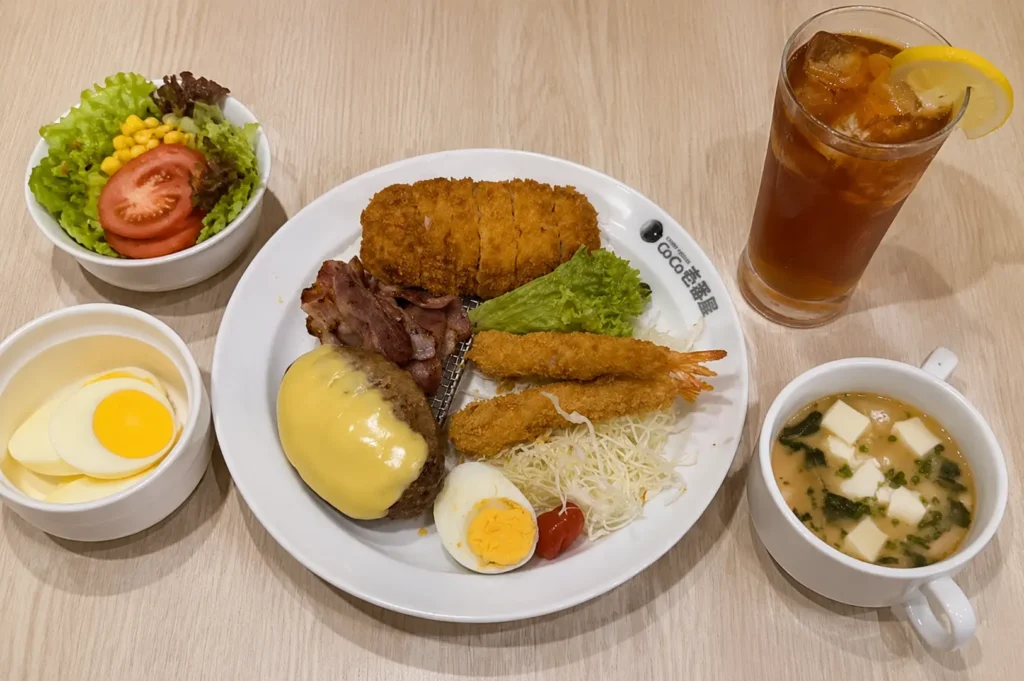 CoCo Ichibanya customizable meal set with pork cutlet, sides, soup, salad, and drink