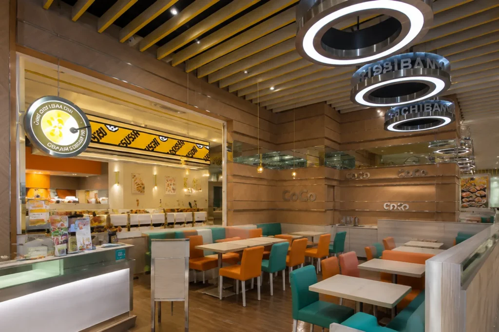 CoCo Ichibanya Bugis+ dining area with colorful seats and modern interior