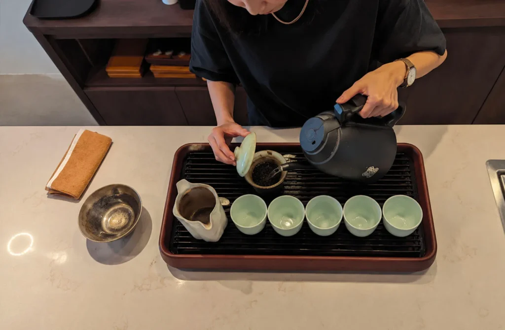 Tea master brewing premium loose-leaf tea at SILK Tea Bar.