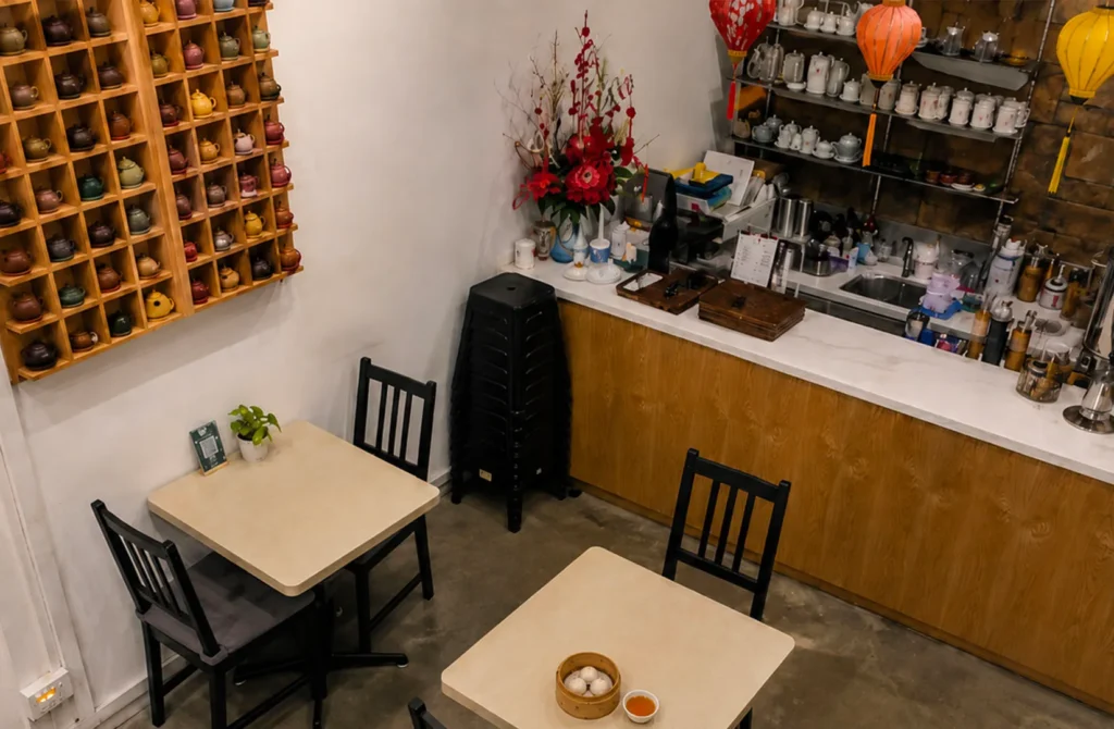 Overhead view of Yixing Xuan Teahouse showcasing intimate seating and handcrafted teapots.